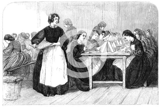 Girls making cartridges for Enfield rifles at the Royal Arsenal, Woolwich, 1862. Creator: Unknown.