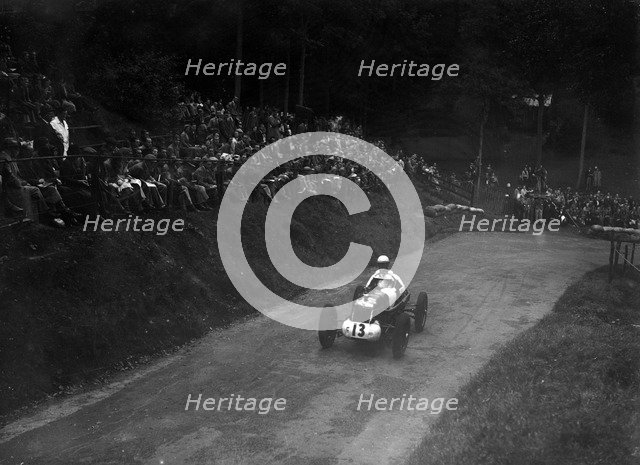 Single-seater MG R type competing in the Shelsley Walsh Hillclimb, Worcestershire, 1935. Artist: Bill Brunell.