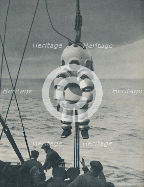 'The Eternal Fight Against the Sea: Armoured Casing for the Deep-Sea Diver', c1935. Artist: Pacific and Atlantic.