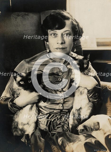 Tilla Durieux with two Siamese cats, 1920s. Creator: Stone, Sasha (1895-1940).