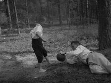 Dmitri Shostakovich plays football with his son Maxim in Komarovo, 1947. Creator: Varzar Shostakovich, Nina Vasilyevna (1909-1954).