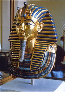 Tutankhamun death mask made of solid gold encrusted with precious stones, found by H. Carter in 1…