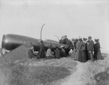 Class from Hampton Institute, Hampton, Va., looking at cannon at Fort Monroe, 1899 or 1900. Creator: Frances Benjamin Johnston.