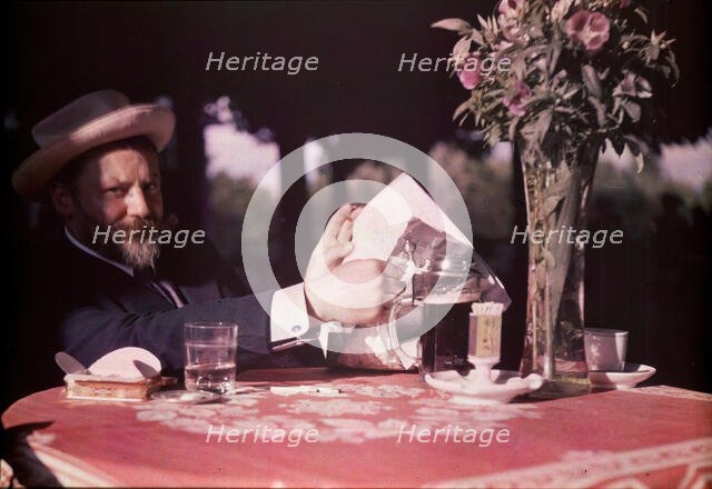 Frank Eugene Seated at Table, 1907. Creator: Alfred Stieglitz.