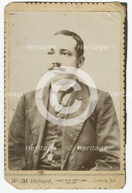 Photograph of a man wearing a dark colored suit with a pocket watch in his vest, 1886-1900. Creator: W. M. Hubbard.