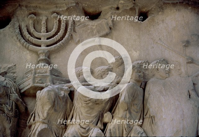 Basrelief in the Arch of Titus representing men carrying a menorah, located in the Via Sacra of t…