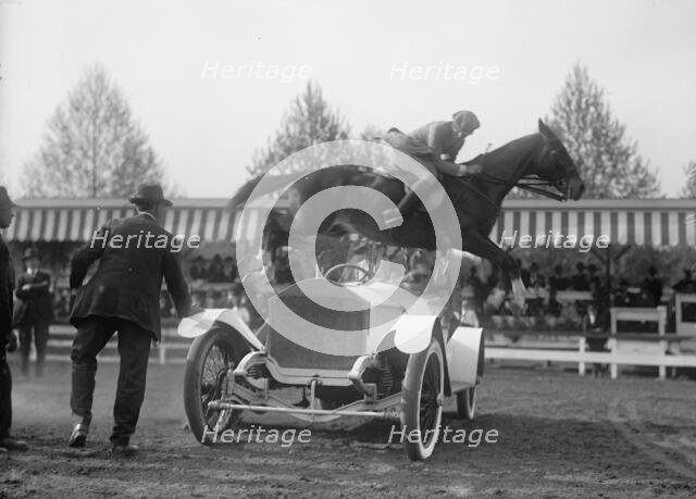 Horse Shows - Ralph Coffin Jumping His Horse Over Sylvanus Stoke's Rolls Royce, 1916. Creator: Harris & Ewing.