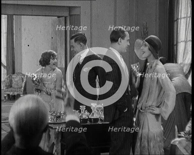 Scene from a 1920s Film. A Group of Actors Playing Bright Young Things Having a Cocktail Party,1920s Creator: British Pathe Ltd.