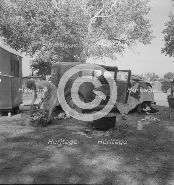 Wife of migratory worker in auto camp, California, 1936. Creator: Dorothea Lange.