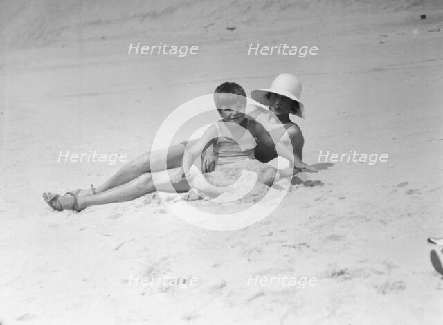 Taylor, Fenton, Mrs., and child, at the beach, 1931 Creator: Arnold Genthe.