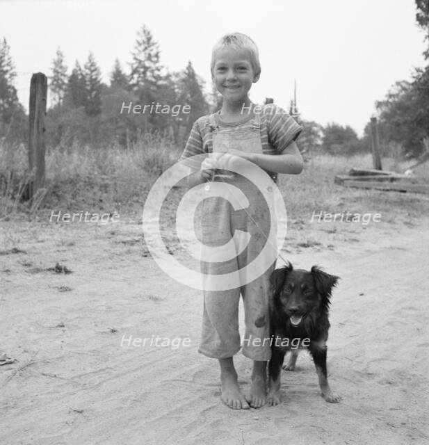 Migrant boy, family, live in grower's camp for..., near Grants pass, Josephine County, Oregon, 1939. Creator: Dorothea Lange.