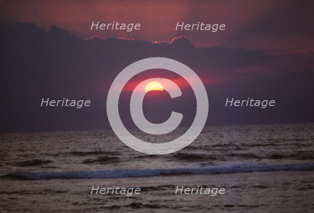 Sunset over Indian Ocean in Hikkaduwa, Sri Lanka, 20th century. Artist: CM Dixon.