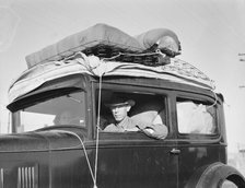 Migratory cotton picker from Kansas on highway near Merced, California, 1939. Creator: Dorothea Lange.