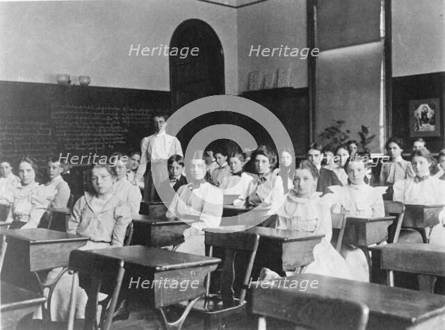Children seated in classroom, Washington, D.C., (1899?). Creator: Frances Benjamin Johnston.