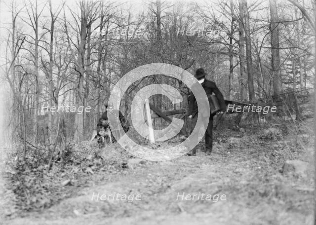 Policeman, police dog, waiting for thief, New York City, 1912. Creator: Bain News Service.