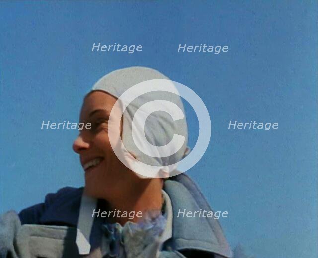 Jean Batten in Flying Gear Smiling to Crowds, 1930s. Creator: British Pathe Ltd.