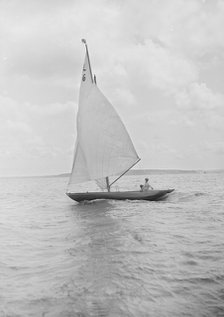 The 6 Metre Class 'The Whim' sailing downwind, 1912. Creator: Kirk & Sons of Cowes.