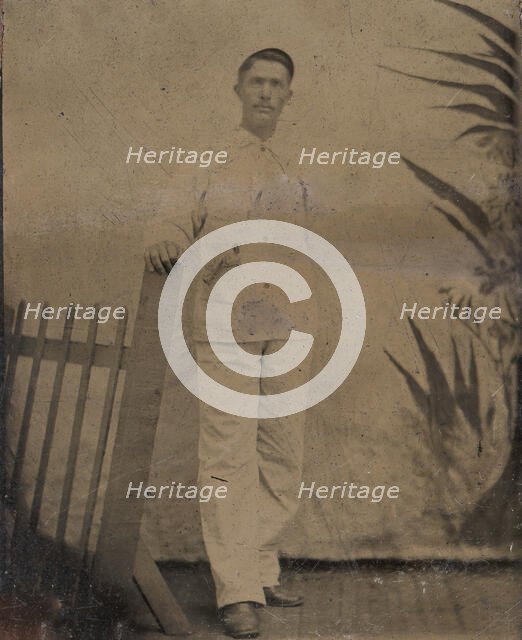 Painter Resting His Hand on Picket Fence, 1860s-80s. Creator: Unknown.