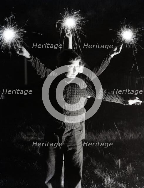 Children with fireworks, c1955. Creator: Arthur Charles Kirby Ware.