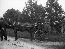 Unknown people in horse drawn cart and coachman; possibly Chester, England (Bache Hall), 1895. Creator: Robert Augustus Henry L'Estrange.
