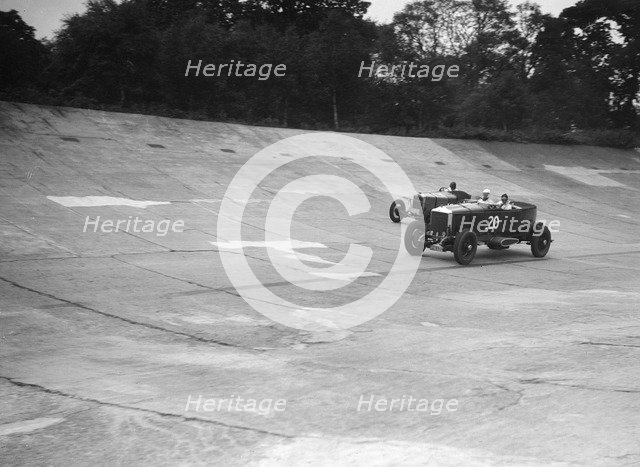 GL Baker's 5954 cc Minerva racing a 1930 Frazer-Nash Sportop on the banking at Brooklands. Artist: Bill Brunell.