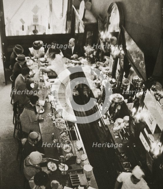 Office workers having lunch at the drug store counter, New York, USA, c1920s-c1930s. Artist: Unknown