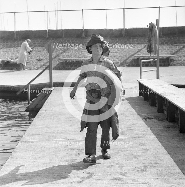 A boy on the jetty, Borstahusen, Landskrona, Sweden, 1964. Artist: Unknown