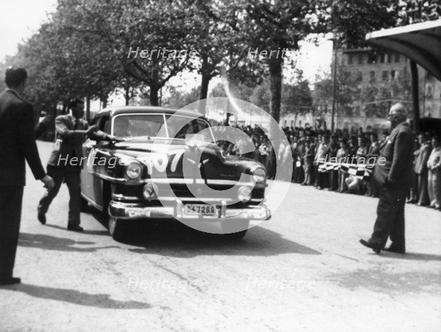 Paul Frere in a Chrysler Saloon V8, in the Mille Miglia, 1953. Artist: Unknown