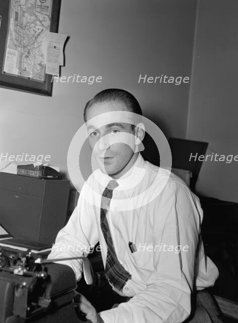 Portrait of Mike Levin, Down Beat office, New York, N.Y., ca. 1947. Creator: William Paul Gottlieb.