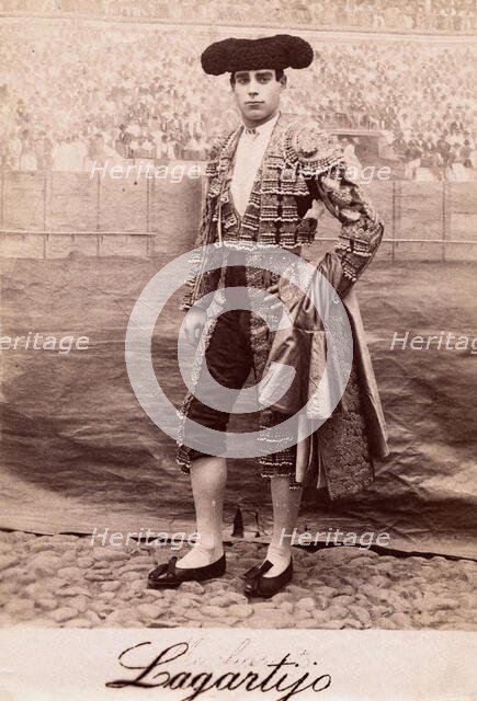 A bullfighter, Rafael Molina Sanchez "Lagartijo", posing in front of a painted back..., c1870s. Creator: Unknown.