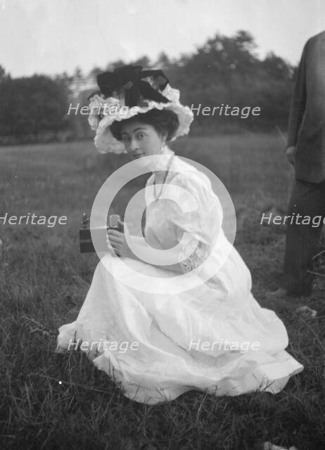 Rainsford, Mrs., seated outdoors, between 1922 and 1924. Creator: Arnold Genthe.