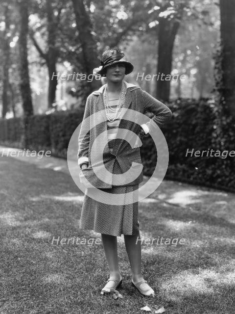 Coco Chanel modeling a Chanel suit on rue Faubourg Saint-Honoré in Paris, 1929, 1929. Creator: Sasha; (Alexander Stewart) (1892-1953).