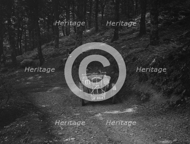 Wolseley Hornet of ARC Rigby taking part in a motoring trial, c1930s. Artist: Bill Brunell.