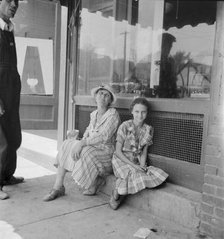 Farm folk spend a day in town, Eden, Alabama, 1936. Creator: Dorothea Lange.