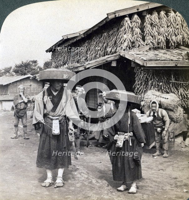 Pilgrim beggars beating little gongs, near Lake Kawaguchi, Japan, 1904. Artist: Underwood & Underwood