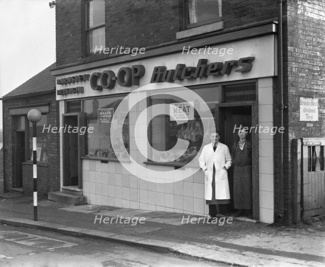 End of rationing, meat and bacon on sale at the Barnsley Co-op butchers, South Yorkshire, 1954. Artist: Michael Walters