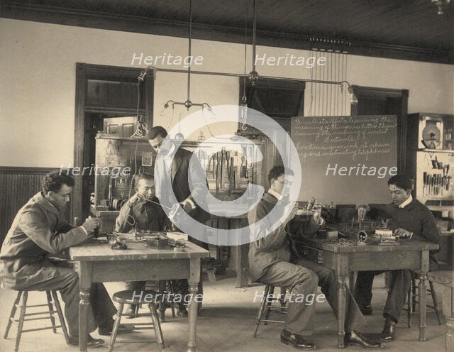 Students constructing telephones at Hampton Institute, 1899 or 1900. Creator: Frances Benjamin Johnston.