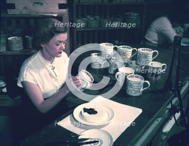 Women hand decorating souvenir mugs commemorating the Coronation of Elizabeth II, 1953. Creator: Arthur Charles Kirby Ware.