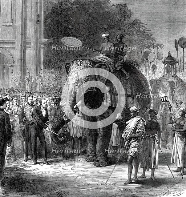 The Prince giving sugar-cane to the elephants at the rehearsal of the Perahara, Kandy..., 1876. Creator: Unknown.