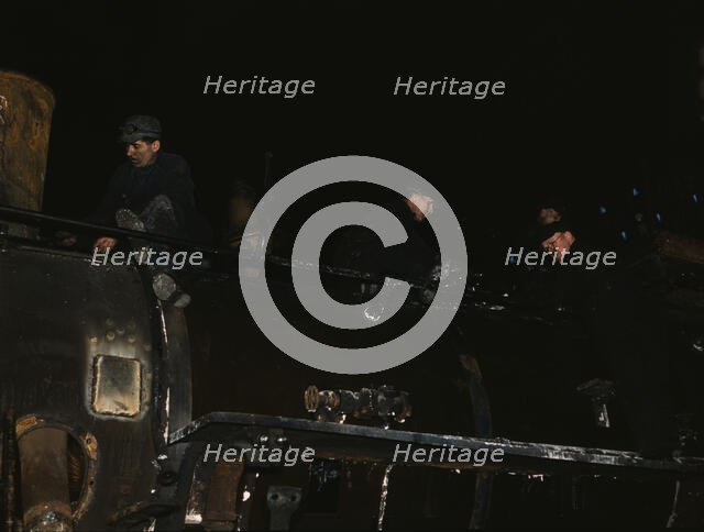 Working on a switch engine at the 40th Street shops of the C & NW RR, Chicago, Ill., 1942. Creator: Jack Delano.