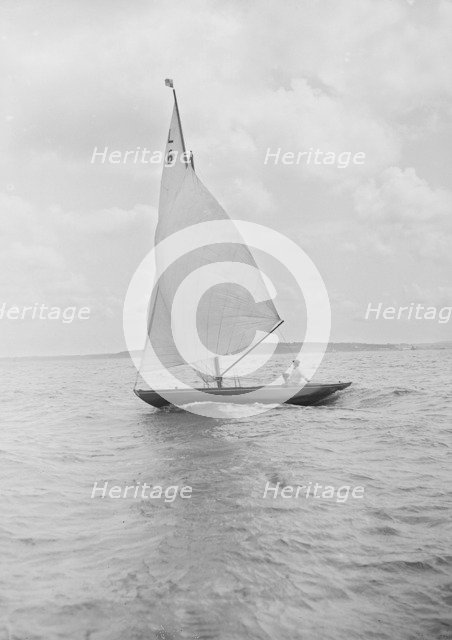 The 6 Metre Class 'The Whim' sailing downwind, 1912. Creator: Kirk & Sons of Cowes.