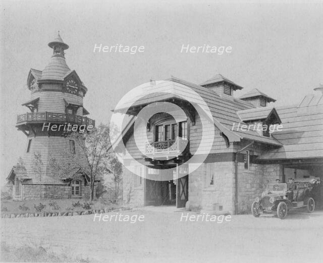 Windmill-shaped clock tower at left, and part of garage of Edmund..., Greenwich, Connecticut, 1908. Creator: Frances Benjamin Johnston.