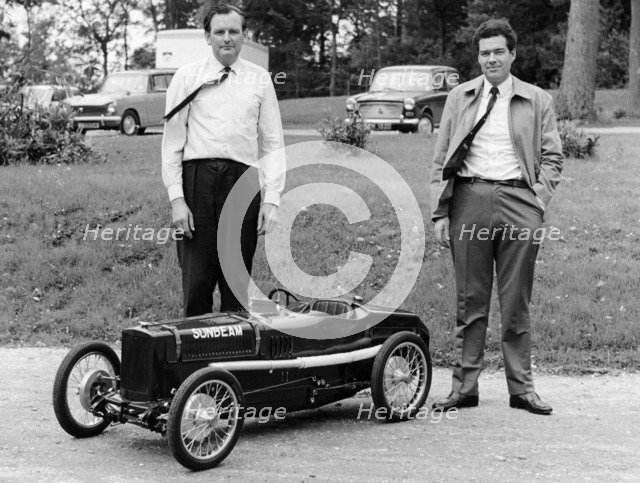 Two men standing by a miniature Sunbeam pedal car, 1960s. Artist: Unknown