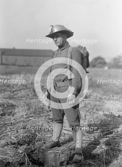 Leonard D.Mahon with Steel Helmet He Invented That Could Be Used As Shovel, 1917. Creator: Harris & Ewing.