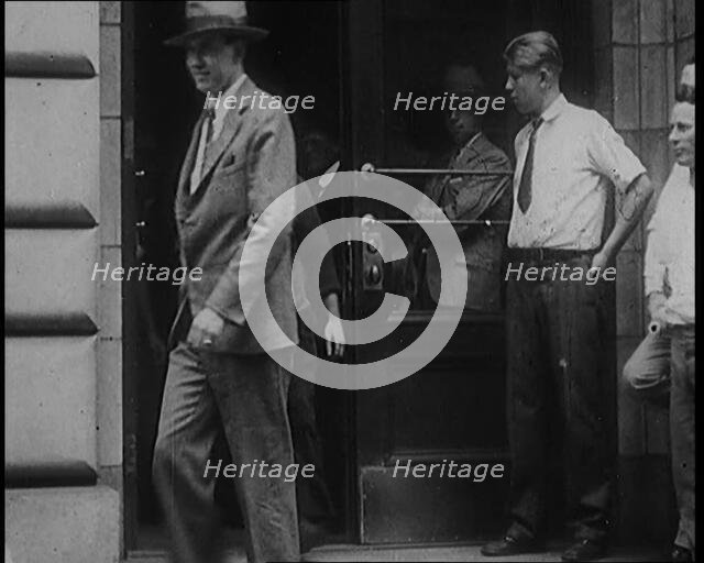 Alcohol Smugglers Coming Out of Court, 1929. Creator: British Pathe Ltd.