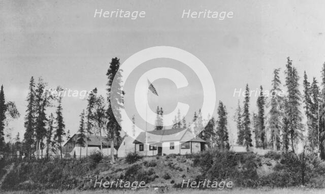 Building with American flag raised, between c1900 and 1916. Creator: Unknown.