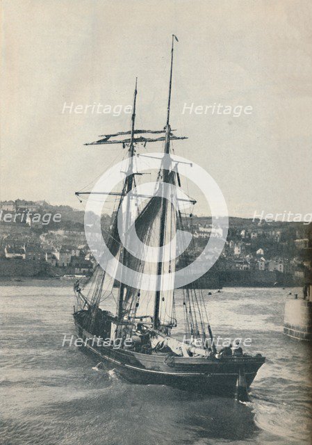 'Sailing Into Newlyn Harbour, the Isabella, a two-masted Lancashire type schooner', 1937 Artist: Unknown.