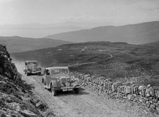 Riley of Miss F Walker leading a Hudson Eight at the RSAC Scottish Rally, 1936. Artist: Bill Brunell.