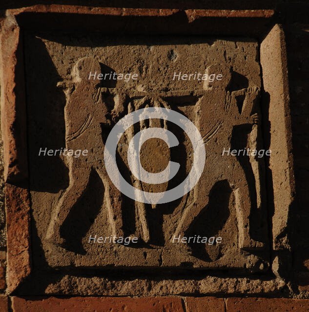 Relief depicting two men carrying an amphora, Pompeii, Italy, 2009. Creator: LTL.