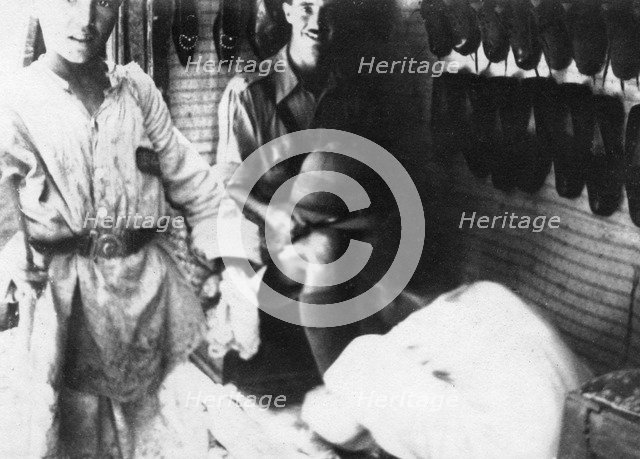 A British officer in a shoe shop, Baghdad, Mesopotamia, WWI, 1918. Artist: Unknown